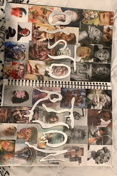 a spiral notebook covered in many different pictures and writing that read's spelled out