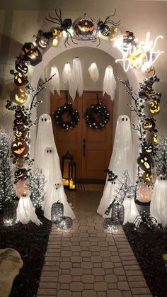 an entrance decorated for halloween with ghost decorations