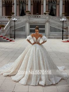 a woman in a wedding dress with her hands on her hips