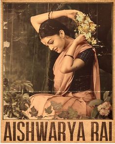 an old photo of a woman with flowers in her hair and the words ashwarya rai written on it