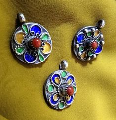 Three ancient Kabyle ethnic pendants to be mounted on necklaces, in solid silver with coral beads. I still have others of the same kind but different on my shop, you can visit it. **Height: 2.5 cm. **Width: 1.9 cm. **Material: sterling silver, real coral. **Total weight: 17.5 grams. **Origin: Region of the Great Kabyle 1980s - Algeria. **Free shipping worldwide by DHL. I am always open to offers for one of my items, so please contact me if you would like to make an offer. Please contact me if yo Traditional Silver Beads Round Pendant Jewelry, Traditional Flower Pendant For Jewelry Making, Traditional Nickel Free Jewelry With Round Beads, Traditional Nickel-free Jewelry With Round Beads, Traditional Jewelry With Round Pendant Natural Stones, Traditional Nickel Free Round Beaded Necklaces, Traditional Nickel Free Round Pendant Necklace, Traditional Nickel-free Pendant Jewelry, Traditional Nickel-free Round Pendant Necklace