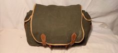 Vintage 1980's military green canvas 2 in 1 - backpack and shoulder bag. Measurements: H - 10'' [ 25cm.]                          W - 15 2/3'' [ 40cm.] / with side pockets /                       Side - 5'' [ 13cm.] One front pocket - H - 7'' [ 18cm.]                              W - 10'' [ 25cm.]                            Side - 2'' [ 5cm.] Two side pockets - each - H - 8 2/3'' [ 22cm.]                                          W - 5'' [ 13cm.]                                       Side - 2'' [ Vintage Green School Bag, Green Vintage School Bag, Vintage Canvas Backpack With Adjustable Strap, Green Canvas Satchel For School, Vintage Khaki Bag For Adventure, Vintage Green Canvas Bag For Travel, Vintage Satchel For School, Khaki Canvas Satchel For School, Canvas Satchel In Khaki For School