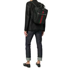 This black "Techno" backpack from Gucci is made of a synthetic canvas. The two-way zipper fastening opens to a black nylon-lined interior with a zipper pocket and two slip pockets. The front of the backpack is decorated with the brand's signature green-red-green 'Web' stripe and leather patch with embossed logo. The double top handles and adjustable shoulder straps add to the functionality of this bag. Model number: 619748 Old Gucci Model # 495558 Canvas Black Silver-tone hardware Green-red-green web stripe Two-way zipper fastening One exterior zipper pocket Black nylon interior lining One interior zipper pocket Two interior slip pockets Double flat leather top handles, drop: 4" Adjustable back straps Measurements: 11 x 5.5 x 13" (LWH) Includes ity cards and Gucci dust bag Made in Italy Gucci Black Backpack With Adjustable Strap, Black Gucci Backpack With Adjustable Strap, Green Web, Black Leather Top, Womenswear Fashion, Gucci Models, Shoe Size Conversion, Herschel Heritage Backpack, Timeless Handbag