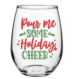 a wine glass with the words pour me some holidays cheer written in red and green