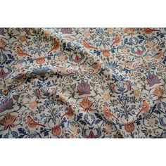 the fabric is very colorful and has many designs on it, like this floral design