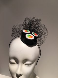 Sushi Fascinator- Sushi headpiece- I love Sushi -Kentucky derby- Derby days- Halloween- Mad hatter headpiece -Polo - Food -Foodie- Mad Hatter Party Hello, This fascinator has three felt California rolls and a bird cage net puff ...It's perfect for a sushi lover and makes a great conversion piece. It's placed in a 1/8inch satin covered headband that's adjustable and very comfortable. ----------------------------------------------------------------- I ship US Postal Service. USA DOMESTIC CHOICES ( Fun Adjustable Carnival Headpiece, Summer Novelty Costume Accessories For Costume Party, Playful Adjustable Costume Accessories For Halloween, Harajuku Style Black Costume Hat For Halloween, Black Harajuku Style Costume Hat For Halloween, Black Harajuku Style Halloween Costume Hats, Playful Adjustable Mini Hats For Costumes, Novelty Black Headband Costume Accessory, Adjustable Fun Mini Hats For Costume Party