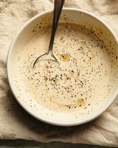 a bowl of soup with a spoon in it