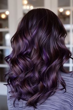 Enhance your natural brown hair with a stunning mix of purple highlights. This vibrant combination creates a bold, eye-catching look that exudes confidence and style. Fall Purple Hair Color For Brunettes, Brunette To Purple Ombre, Dark Hair With Purple And Blonde Highlights, Purple Highlights For Dark Brown Hair, Dark Brown With Purple Hair, Brown Hair With Purple Ombre, Dark Brown Hair With Violet Highlights, Highlights Brown Hair Purple, Dark Brown Hair With Violet Undertone