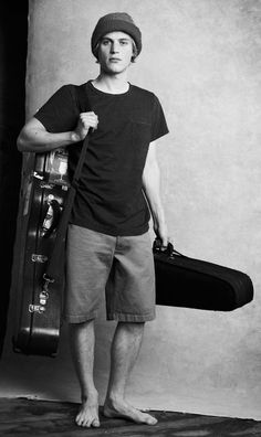 black and white photograph of a man holding a suit case