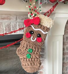 a crocheted christmas stocking hanging from a fireplace