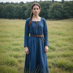 This navy blue Viking-inspired dress is perfect for those who appreciate historical and minimalist styles. The lace-up front and braided belt add an authentic touch, making it ideal for medieval reenactments, Renaissance festivals, or Nordic-themed events. The classic design ensures both comfort and style, making it versatile for a range of occasions. Whether you're attending a festival or participating in a reenactment, this simple yet elegant gown offers a timeless look that brings history to life. Perfect for anyone seeking an authentic Viking or medieval aesthetic. I hope you will love my design as much as I enjoyed creating it for you! ----Important Information---- Please, be aware that all pictures are designer's illustrations. The actual product may slightly differ in look. Also, a Rustic Cottagecore, Medieval Aesthetic, Viking Dress, Themed Events, Braided Belt, Gowns Of Elegance, Inspired Dress, Dress Clothes For Women, Minimalist Fashion