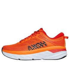 an orange and white running shoe with black lettering on the upper part of the shoe