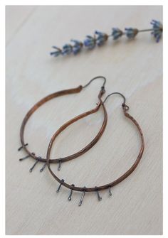 Tribal hoop earrings. For large hoop earrings lovers. These rustic, rich textured and oxidized copper hoop earrings are very eye catching! Mixed metal earrings, hand crafted from 12 gauge pure copper wire; measured, cut, shaped, drilled, hammered, texturized and oxidized by hand. The hanging spikes through the copper are made of sterling silver, and also oxidized in a dark patina. Nice boho hoops! ♥ The texture of the hammered hoops is rich, earwires are also handmade from copper wire. I can mak Metalwork Jewelry, Mixed Metal Earrings, Oxidized Copper, Large Hoop Earrings, Metal Earrings, Copper Earrings, Mixed Metals, Pure Copper, Copper Wire