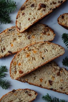 slices of bread on a white plate with green sprigs