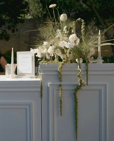 a table with flowers and candles on it