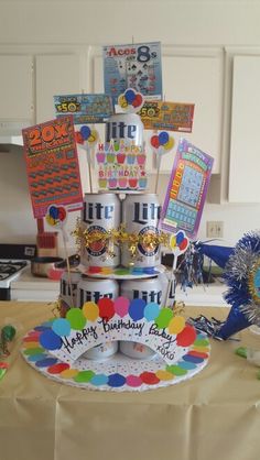 a birthday cake with balloons and decorations on it