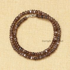 Product Description: Item Code: SGH-571 Stone Name: Chocolate Moonstone Size: 8MM Shape: Smooth Rondelle Color: Brown  Length: 18 Inches (Approx.) Weight: 153Cts (Approx.) Lock: 925 Lobster Clasp **All natural gemstones vary in color and pattern. We try our best to make our photos represent the real products in person. ** **All Customization Facility Is Available as per your Requirement Also in Other stones. ** **Bulk Order also available** **Please feel free to contact for any further queries** Moonstone Beads, Bulk Order, Jewelry Gift, Lobster Clasp, Moonstone, Gemstone Jewelry, Natural Gemstones, Gift For Her, Jewelry Gifts