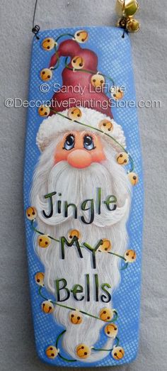 a sign with a santa clause on it that says, jingle my bells and is hanging from a hook