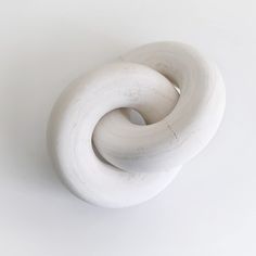 a white sculpture sitting on top of a table