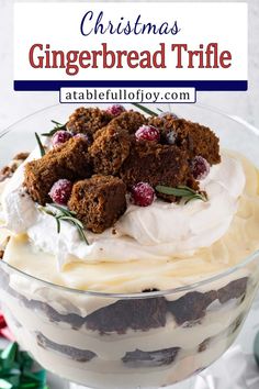 christmas gingerbread trifle in a glass dish with whipped cream and cranberries