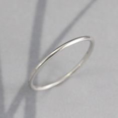 Platinum Band Spacer Ring 1.25mm Full Round Band Platinum Ring Platinum Wedding Band Platinum Wedding Ring Platinum Stacking Ring This is the perfect spacer ring or petite wedding band! Hand made from 16 gauge (1.25mm) full round material, it is sturdy while maintaining a slim profile. Your ring will be handmade to size just for you and can have either a high polished finish or soft matte brushed finish. Platinum is 30 times more rare than gold. It takes special skill and training to properly wo Wedding Band With Smooth Bezel, Simple Stackable Round Band Wedding Rings, Simple Stackable Wedding Rings With Round Band, Simple Round Wedding Bands, Simple Polished Stackable Wedding Rings, Simple Stackable White Gold Rings, Simple White Gold Round Band Rings, Polished Finish Midi Wedding Rings, Wedding Stackable Rings With Smooth Bezel