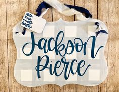 a wooden sign that says jackson pierce on the side of a wood planked wall