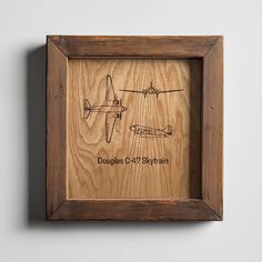 a wooden frame with an airplane drawing on it