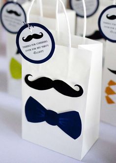 paper bags with mustaches and bow ties on them