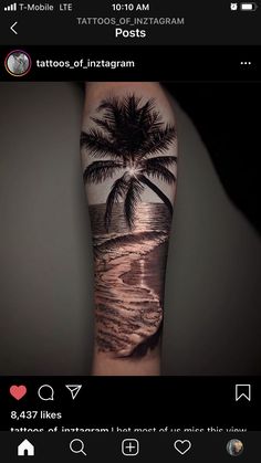 an arm tattoo with a palm tree on the beach and waves coming in from the ocean