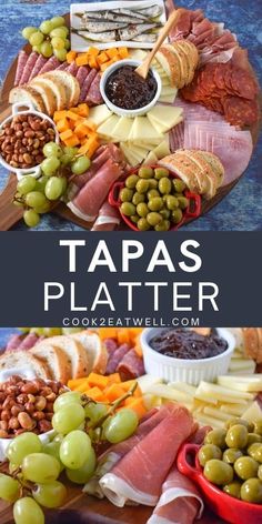 a platter filled with meats, cheese and olives next to other foods