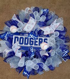 a wreath made out of plastic cups and baseballs