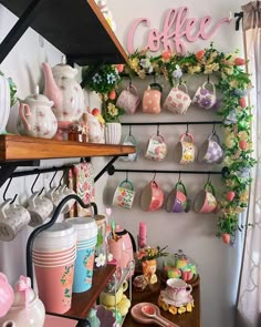 a shelf filled with cups and mugs next to a wall mounted coffee pot rack