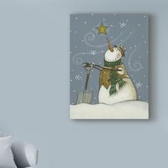 a snowman is holding a shovel in his hand