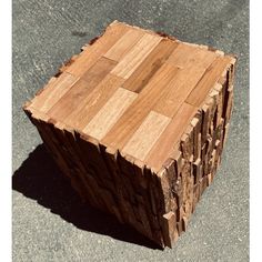 a piece of wood that has been cut into squares and placed on top of concrete