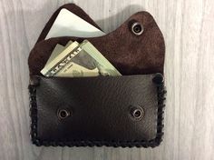 "These leather double coin purses are handy to use, you can put a few coins in either pouch, or a few double folded bills or paper notes and even one credit card will fit in one section. If u put credit card in, the coins mite not work. So if you have one card in one pocket, and some bills in the other pocket, or some bills in one pocket and a few coins in other pocket it will work. Measures 4-1/4\" x 2-1/2\" when closed. If you want a tough strong coin purse, this is it, I used cowhide leather Brown Coin Purse With Interior Card Slots, Brown Wallet With Cell Phone Pocket As Gift, Leather Coin Purse With Cell Phone Pocket As Gift, Bifold Coin Purse With Cell Phone Pocket As Gift, Leather Coin Purse With Interior Card Slots As Gift, Leather Coin Purse With Card Slots As Gift, Brown Card Holder With Coin Pocket, Perfect As Gift, Brown Card Holder With Coin Pocket As Gift, Brown Card Holder With Coin Pocket For Gift