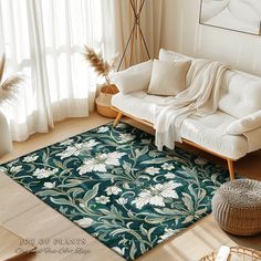 a living room with a white couch and green rug