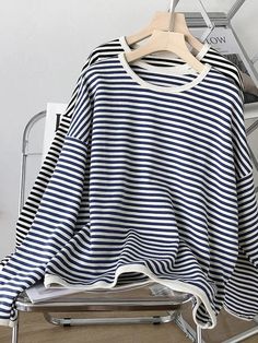 This is perfect for those who are looking for a clothing for a good price. It is fashionable, stylish, and it will look great on anyone who wears it. Do you wanahavit? Navy Long Sleeve Loungewear Sweater, Navy Long Sleeve Sweater For Loungewear, Oversized Navy Tops For Winter, Navy Oversized Winter Tops, Casual Striped Hoodie Sweatshirt, Oversized Striped Long Sleeve Sweatshirt, Navy Casual Sweatshirt For Spring, Navy Oversized Top With Ribbed Cuffs, Oversized Navy Top With Ribbed Cuffs