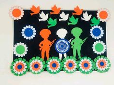 an art project with paper cut outs and flowers on the side, depicting two people holding a flag