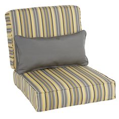 a yellow and gray striped chair with a pillow on top of the armrests