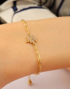 Add a touch of luck and elegance to your wrist with our 14K Gold Clover Bracelet. This dainty four-leaf clover bangle is the perfect lucky charm jewelry for her. Crafted with care and attention to detail, this bracelet features a delicate clover charm symbolizing good fortune and prosperity. Made from high-quality 14K gold, this bracelet exudes a luxurious and timeless beauty. It's designed to be both delicate and durable, making it suitable for everyday wear. Whether it's worn on its own or paired with other bracelets, this lucky charm jewelry adds a touch of sophistication to any outfit. This bracelet also makes a thoughtful gift for someone special. The four-leaf clover is a universal symbol of luck and good fortune, making it a meaningful present for birthdays, anniversaries, or any sp Elegant Good Luck Bracelet Jewelry, Elegant Good Luck Jewelry Bracelet, Delicate Bracelet Gold, Bracelets Christmas, Delicate Gold Bracelet, Clay Accessories, Lucky Leaf, Clover Jewelry, Clover Bracelet