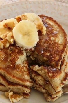 pancakes with bananas and syrup on a plate