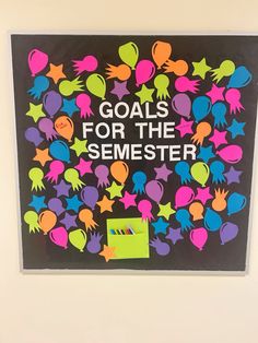 a bulletin board that says goals for the semester