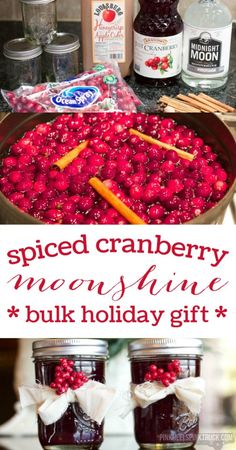 two jars filled with cranberry jam and cinnamon sticks on top of a table