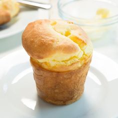 a muffin sitting on top of a white plate