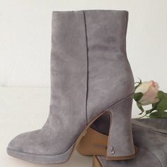 Brand New, Ice Grey Suede Jayne River Rock Suede Ankle Booties With Block Heels By Sam Edelman. Size 8.5. Brand New In Box With A Dust Bag And An Inner Ankle Zippers For Easy On / Easy Off Access. Check Out The Silver Monogrammed "S" On Each Heel. The Block Heels Measures At 4" Inches. Super Cute "Throwback To The 80's" Footwear. Excellent Condition!! Please See All Pictures For Different Views. Silver Monogram, S Monogram, Gray Suede, River Rock, Suede Booties, Sam Edelman, Ankle Booties, Block Heels, Bootie Boots