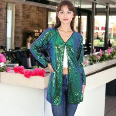 Make a statement with the Anna-Kaci Women's Sequin Open Front Cocktail Outerwear Jacket, a sophisticated and eye-catching piece perfect for any occasion. This shiny disco jacket boasts an open front with hook & closure and long sleeves, ensuring you'll stand out wherever you go. Glamorous Spring Cardigan For Parties, Chic Stretch Cardigan For Party, Fitted Open Front Party Outerwear, Trendy Open Front Party Outerwear, Fitted Open Front Outerwear For Party, Glamorous Sequined Cardigan For Spring, Glamorous Spring Cardigan For Night Out, Sequin Cardigan For Night Out In Spring, Sequin Cardigan For Spring Night Out