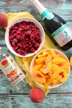 the ingredients to make this fruit salad include peaches, raspberries and champagne