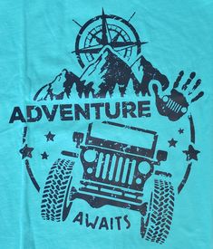 a blue t - shirt with an image of a jeep on it's chest