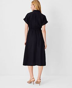 Elevate your wardrobe with the Ann Taylor Crossover Collared Midi Shirtdress, a versatile piece that promises effortless style and comfort. Perfect for a variety of occasions, this dress features a flattering crossover front and a chic point collar.

- **Size:** Regular 00
- **Color:** Black
- **Gender:** Female
- **Material:** Shell: 67% Lyocell, 18% Linen, 15% Viscose; Lining: 100% Polyester
- **Sleeve Length:** Short
- **Length:** 28 inches from natural waist
- **Fit:** Hits below the knee
- Fitted Black Belted Dress For Summer, Relaxed Fit Belted Dress For Work, Black Collared Dress With Relaxed Fit, Black Relaxed Fit Collared Dress, Casual Black Belted Dress, Summer Belted Shirt Dress In Relaxed Fit, Belted Relaxed Fit Shirt Dress For Summer, Summer Belted Shirt Dress With Relaxed Fit, Relaxed Fit Dresses With Tie Waist For Work