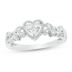 a heart shaped diamond ring on a white background